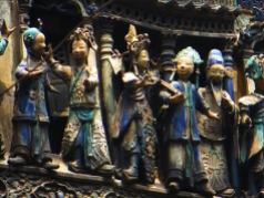 small figurines on top of the temple